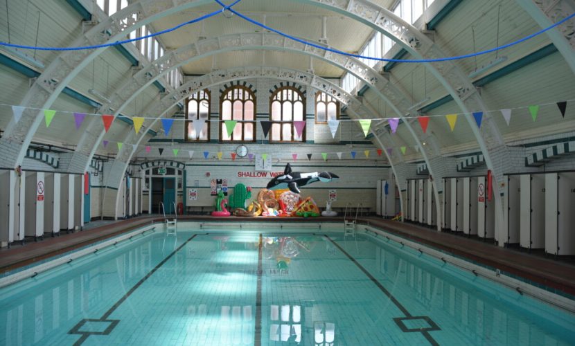 A photograph of Pool 2 with water in it and novelty inflatables balanced at the end of the pool.